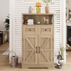 a wooden cabinet sitting in front of a white wall