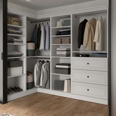 an organized closet with white shelves and drawers