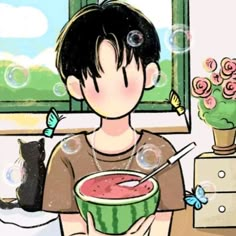 a boy holding a bowl of watermelon and a black cat