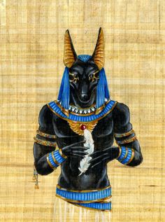 an egyptian black cat wearing blue and gold