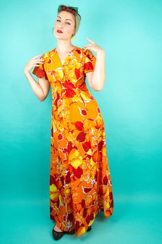 "1960s 70s Orange Hawaiian Dress Small - Hawaiian Maxi Dress - Beautiful and Bright Hawaiian Floral Print - Orange, Yellow, Red, White and Black - Empire Waist - V Neck and Butterfly Sleeves - Zipper Up the Back Labels/Materials: Made in Hawaii - RN 39630 (Leads to Company Name SA-NE HAWALL) - 100% Polyester - Style 390 - Size 8 - Wash cold water mild soap - Tumble dry warm - Do not bleach, soak or twist - Cool iron if needed Measurements: ** Seam to Seam Shoulder to Shoulder: 14\" Bust: 32\"Max Retro V-neck Lined Maxi Dress, Retro Dress With Orange Retro Print, Retro A-line Maxi Dress, Retro Summer Maxi Dress, Orange Retro Dress With Retro Print, Orange Dress With Retro Print, Retro Lined Maxi Dress For Beach, 1970s Style Summer Maxi Dress, Retro Maxi Dress For Beach