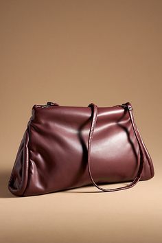 Polyurethane; polyester lining Removable crossbody strap One inner zip pocket Zipper styling Imported | Oversized Pillow Clutch by Anthropologie in Purple, Women's, Polyester Oversized Pillow, Oversized Pillows, Oversized Style, 50 Fashion, Crossbody Strap, Color Coding, Women's Accessories, Zip Pockets, Anthropologie