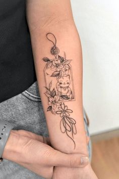 a woman with a tattoo on her arm