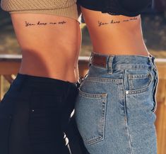 two women with tattoos on their stomachs and the words you have not seen above them