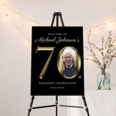 a black and gold 70th birthday sign with an image of the queen on it