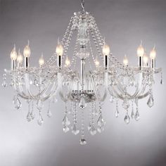 a crystal chandelier with five lights hanging from it's center and four arms