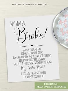 a card with the words my water broke on it next to a bowl of marshmallows