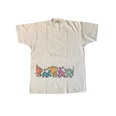 "Vintage 90s Keith Haring T-shirt Used condition. Has yellow stains. See pics! 100% cotton Single stitch THIS IS USED ITEM ! PLEASE DONT EXPECTED IT TO BE LIKE NEW OR IN PRISTINE CONDITION ! Size on tag: XL. Please check the measurements ! Measurements: Shoulders: 50 cm. (19.6\") Pit to Pit: 58 cm. (22.8\") Length: 82 cm. (32.2\") Worldwide Shipping: Approximate delivery time 14-30 days. Please be careful and ask any specific questions about item before purchasing. I can send you additional deta Cheap Throwback T-shirt With Direct To Garment Printing, Cheap 90s Inspired Cotton T-shirt, 90s Style Cotton T-shirt With Graffiti Print, 90s Style Relaxed Fit Graffiti T-shirt, Aaron Core, 90s Shirts Graphic Tees, Special Forces Patch, Keith Haring T Shirt, Fashion 2000