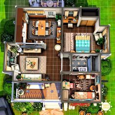 an aerial view of a house with furniture and decor in the living room, dining area, kitchen and bedroom