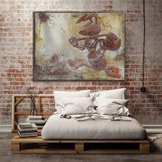 a bedroom with a brick wall and a large painting on the wall above the bed