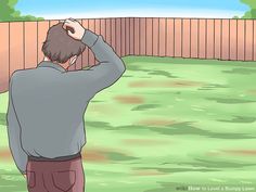 a man is standing in the yard with his hand on his head