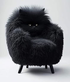 a black cat is sitting in a fluffy chair