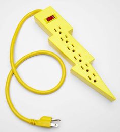 a yellow power strip plugged into an electrical outlet