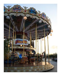 a merry go round with people riding on it