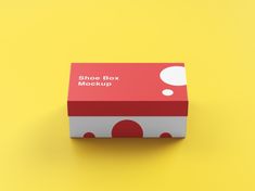 a red and white box with polka dots on the bottom that says shoe box mockup