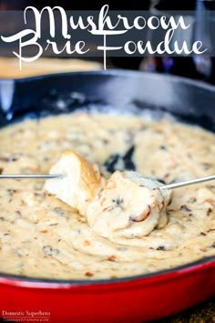 a red pan filled with mushroom and broccoli dip