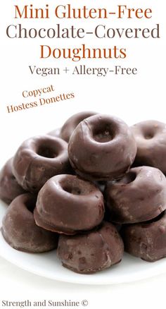 chocolate covered doughnuts on a white plate with the title, mini gluten - free chocolate covered doughnuts