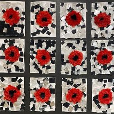 several pieces of torn up paper with red flowers on them and black squares in the middle