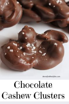 chocolate cashew clusters with white sprinkles in the middle and on top