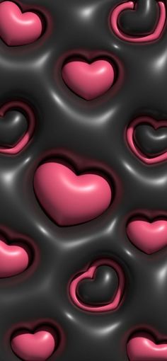 some pink and black hearts are floating in the air on a dark background with white dots