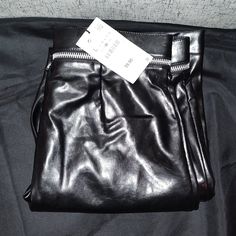 The Pants Are Brand New, But Have Some Scuffs/Blemishes As Seen On Pics. Size: L Material: Polyurethane, Polyester Waist Laid Flat: Approx 17" Inseam: Approx 32" Length: Approx 44" Color: Black Style #: 5427 533 Chic Black Bottoms With Metal Zipper, Black Leather Trousers With Zipper Closure, Faux Leather Bottoms With Side Zipper For Work, Faux Leather Bottoms For Work, Edgy Leather Pants With Zipper For Work, Edgy Leather Pants For Work With Zipper Closure, Edgy Leather Pants With Zipper Closure For Party, Party Faux Leather Bottoms With Side Zipper, Faux Leather Bottoms With Zipper For Going Out