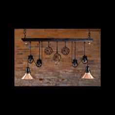 an industrial style chandelier with five lights hanging from it's sides and four circular pendants