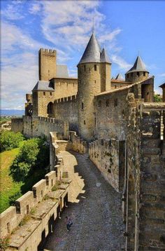 an old castle with stone walls and towers