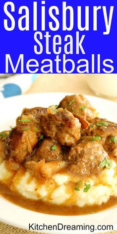 a white plate topped with meatballs and gravy on top of mashed potatoes