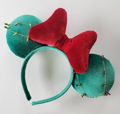 a green and red mickey mouse ears headband