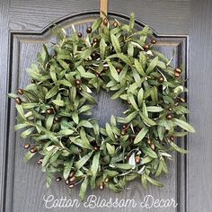 a wreath is hanging on the front door