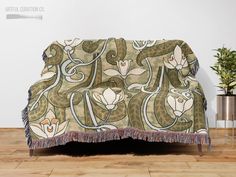 Art Nouveau Lily Pattern Woven Jacquard Blanket A floral art nouveau painting becomes a cozy work of art perfect for your bed or couch, lazy movie nights or just adding a touch of artistic flare to your space. This high-quality and finely made blanket will add a beautiful touch to any interior. Makes a unique gift for friends, family, or yourself! ---------------------------------------------------------------- These premium natural cotton throws are lightweight and super soft to the touch and b Lilies Aesthetic, Art Nouveau Lily, Jacquard Blanket, Art Nouveau Painting, Floral Art Nouveau, Lily Pattern, Aesthetic Home Decor, Floral Tapestry, Cotton Throws