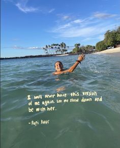 a man swimming in the ocean with a quote written on it