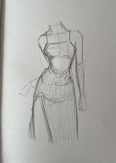 a pencil drawing of a dress on a paper