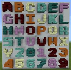 the letters and numbers are made out of lego blocks, with different colors on them