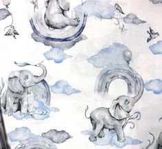 an elephant wallpaper with blue clouds and elephants on it's side, in front of a white background