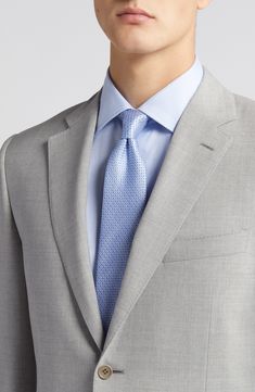 Italian wool woven in a subtly heathered grey brings polish and distinction to a suit styled with traditional detailing for all-occasion versatility. Jacket has notched lapels; four-button cuffs; chest pocket; flap pockets; side vents Cuff buttons may not be attached. Jackets purchased at full price can have the sleeve length customized for free at your local Nordstrom Trousers have zip fly with button-tab closure; slant pockets; back button-welt pockets Jacket is lined Unhemmed 100% wool Dry cl Tailored Gray Semi-formal Suit, Tailored Gray Suit For Semi-formal Occasions, Semi-formal Tailored Gray Suits, Gray Business Suits With Notch Lapel, Tailored Gray Business Suit, Professional Gray Business Suit, Gray Tailored Suit And Tie Accessories For Business, Gray Wool Suits With Notch Lapel, Gray Wool Suit For Semi-formal Occasions