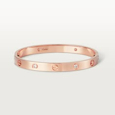 Cartier - LOVE bracelet, 4 diamonds - Bracelet Pink gold/Diamond - LOVE bracelet, 18K rose gold, set with 4 brilliant-cut diamonds totaling 0.42 carats. Sold with a screwdriver. Width: 6.1mm. The iconic #LOVE# bracelet has been a symbol of free-spirited #LOVE# since 1969. Its screw motif and famous locking technology are truly timeless design signatures, while its oval shape ensures a close but comfortable fit to the wearer’s wrist. The locking mechanism consists of two functional screws found o Quotes For Wife, The Bling Ring, Wife And Husband, Birthday Sister, Cartier Bracelet, Wrist Jewelry, Luxury Bracelet, Luxe Jewelry, Bracelet Love