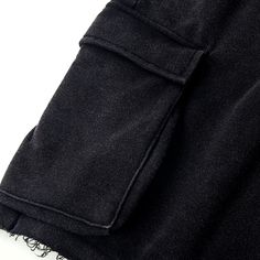 Baggy Cotton Black Cargo Shorts Beach - Raw Edge Helms - The baggy black cargo shorts are instantly eye-catching in the urban setting. Carefully crafted from 320GSM high-quality combed cotton with a breathable French Terry interior, these comfy shorts are tailored to a laid-back fit with design details that make them stand out from other cargo shorts. The side accordion pockets provide functionality and a structured look, while the distressed hem adds a rugged and edgy touch that contrasts perfe Baggy Cargo Shorts With Side Pockets For Streetwear, Black Grunge Bottoms With Side Pockets, Urban Style Short Cotton Cargo Pants, Short Cotton Cargo Pants For Streetwear, Black Cargo Style Shorts, Urban Black Shorts With Multiple Pockets, Black Cargo Style Shorts For Streetwear, Casual Black Short Length Cargo Pants, Black Short Length Cotton Cargo Pants