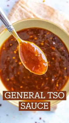 a spoon full of general tso sauce on top of a white tablecloth with the words general tso sauce over it