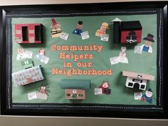 community helpers in our neighborhood bulletin board with magnets and paper cutouts on it