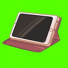 an electronic device sitting on top of a green screen with the cover open to show it's display