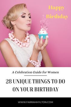 a woman holding a cupcake with the words happy birthday written on it in front of her