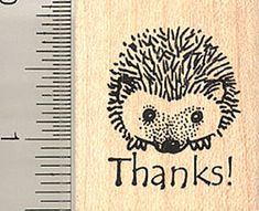 a rubber stamp with an image of a hedgehog on it's face and the words thanks