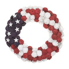 a wreath with red, white and blue flowers in the shape of an american flag