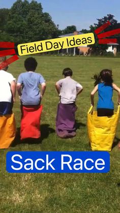 four people sitting in the grass with their backs turned to look like they are facing each other