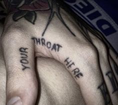 two hands with tattoos that say, you're not here and your dad on them