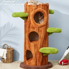 a cat is sitting on top of a tree house that has green carpet and grass