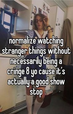 a woman standing in front of a refrigerator with the caption normalize watching strange things without