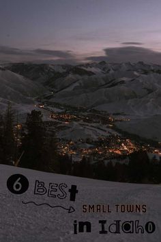 snow covered mountains with the words best small towns in idaho written on it at night