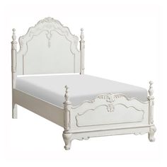 a white bed with an ornate headboard and foot board is shown against a white background